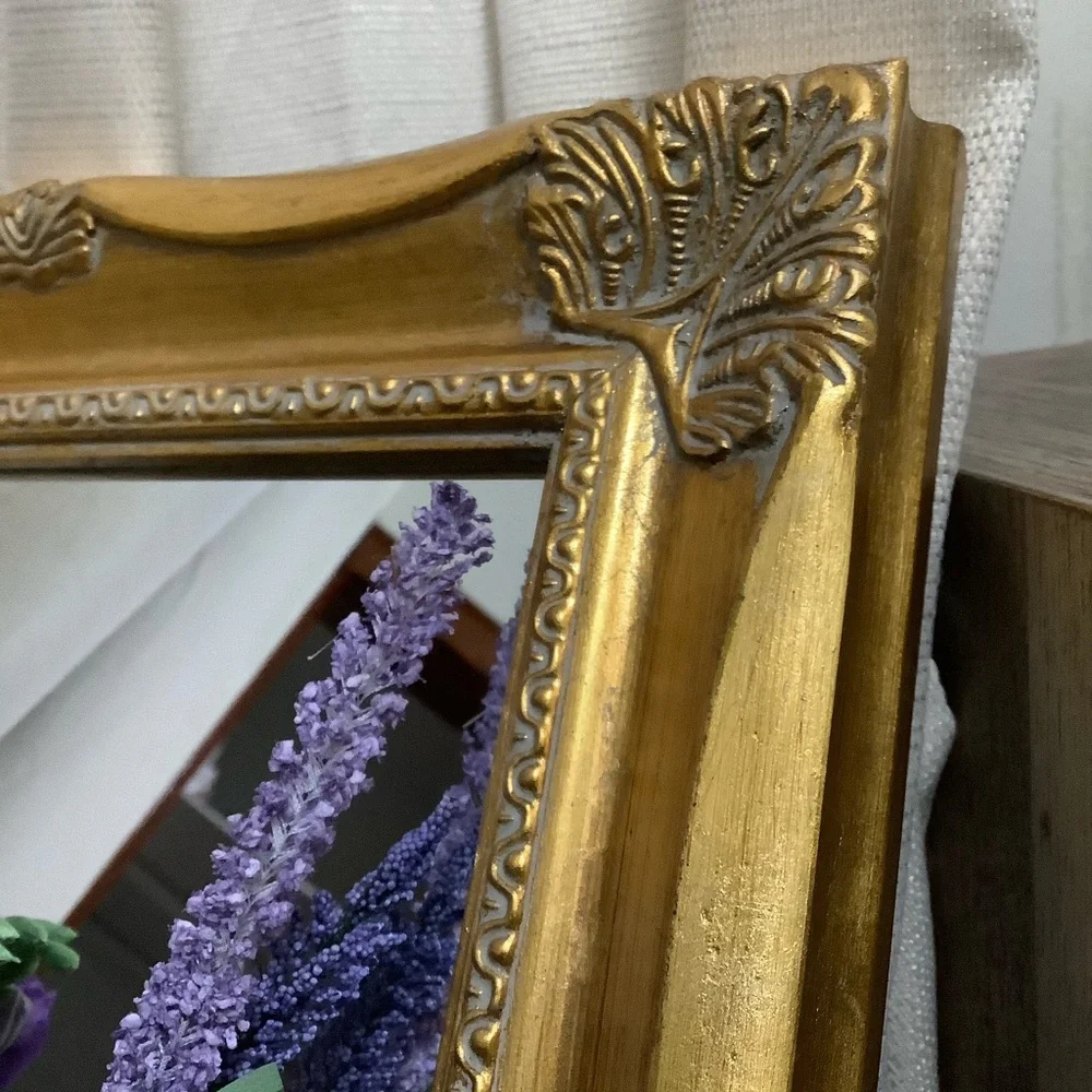 Ornate Gold Wall Mirror with Decorative Frame